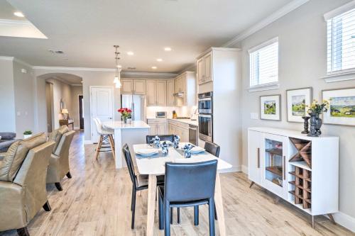 a kitchen and living room with a table and chairs at Sun City House with Fire Pit in 55 and Over Comm! in Georgetown
