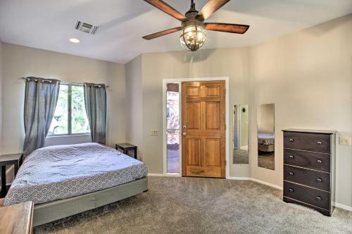 a bedroom with a bed and a ceiling fan at Tranquil Green Valley Townhome with Mtn Views! in Green Valley