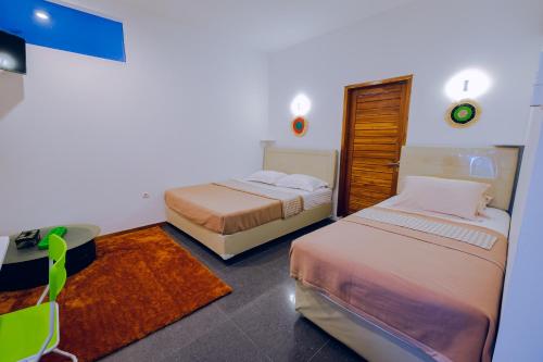 Tempat tidur dalam kamar di Calda Homestay Syariah