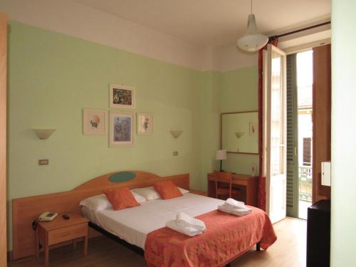 Postel nebo postele na pokoji v ubytování Hotel Massimo