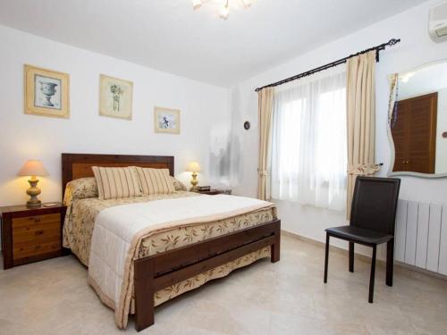 Un pat sau paturi într-o cameră la Villa Florencia