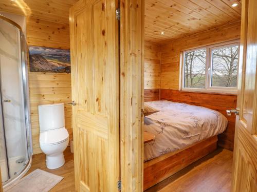 מיטה או מיטות בחדר ב-Stag Lodge Pod