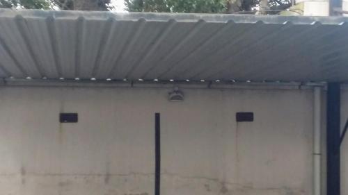 a close up of a garage door with a roof at Dpto. luminoso, céntrico, nuevo: LA SERENA in Tandil