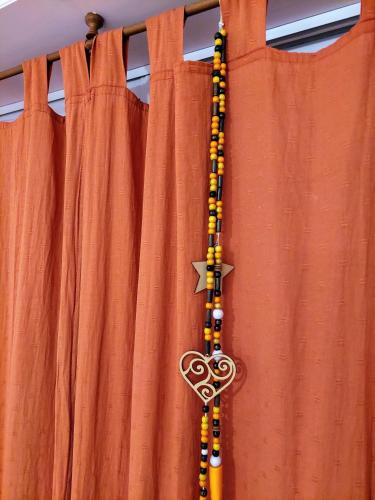 a cross on a curtain with a heart and a star at Dpto. luminoso, céntrico, nuevo: LA SERENA in Tandil