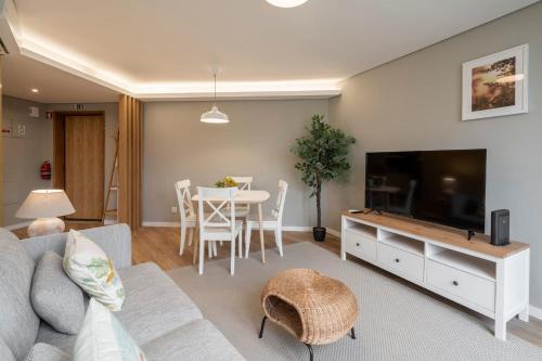 a living room with a couch and a table at The Mountain Apartment by An Island Apart in Funchal