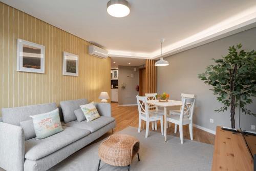 a living room with a couch and a table at The Mountain Apartment by An Island Apart in Funchal