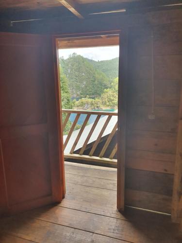 an open door to a balcony with a view at Cabañas Cinco Lagos in Santiago
