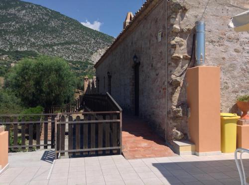 a stairway to a building with a gate at Antico Frantoio in Cerchiara di Calabria
