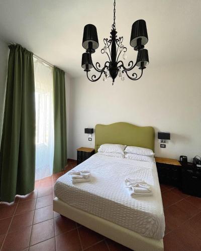 Postel nebo postele na pokoji v ubytování Dolce Vita Suite Alghero