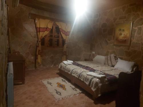 Ein Bett oder Betten in einem Zimmer der Unterkunft Ferme D’hôte La Vallée
