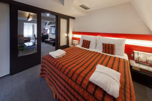 מיטה או מיטות בחדר ב-Prague Inn