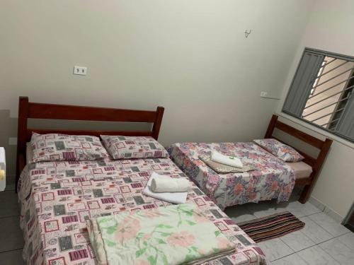 Giường trong phòng chung tại Pousada Vidal