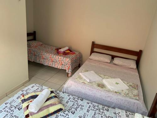Un pat sau paturi într-o cameră la Pousada Vidal