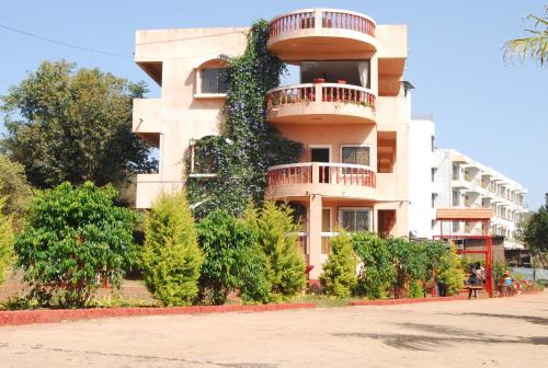 a building with a plant on the side of it at Quinte Hills Residency in Panchgani
