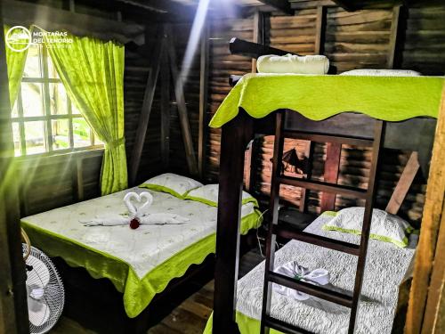 Postel nebo postele na pokoji v ubytování Cabañas Montañas del Tenorio