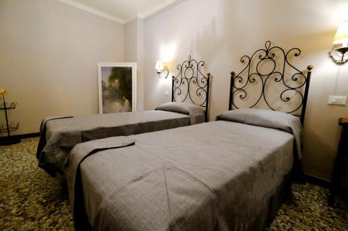 Posteľ alebo postele v izbe v ubytovaní la Casa di Francesco e Rosina