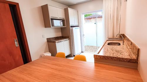 
A cozinha ou cozinha compacta de Hotel Brasil
