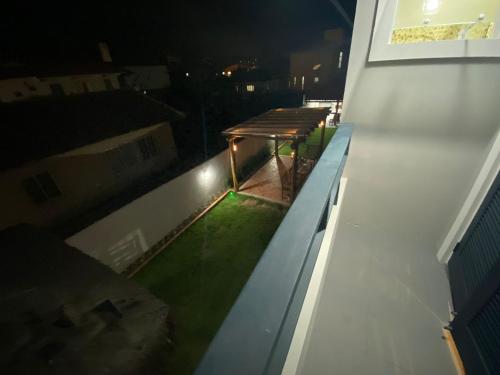 a picnic table on the roof of a building at night at Pousada Recanto Forte in Florianópolis