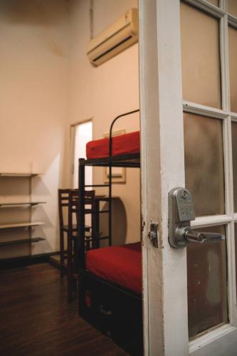 an open door to a room with two bunk beds at IDEAL SOCIAL Hostel in Buenos Aires