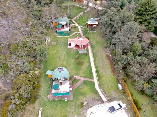 an aerial view of a house with domes at Glamping sede campestre Mirador de Pueblo Viejo in Guatavita