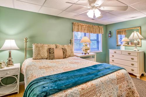 a bedroom with a bed and a ceiling fan at Haddock Haven-3 in Lake Junaluska