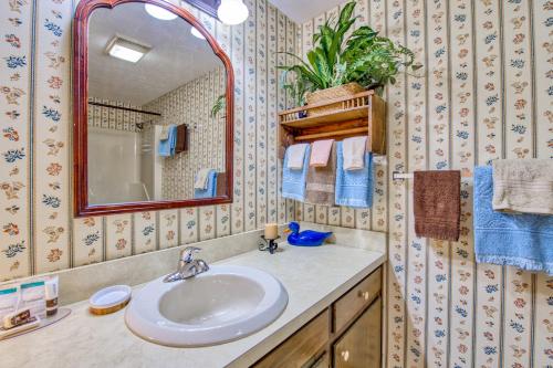 a bathroom with a sink and a mirror at Haddock Haven-3 in Lake Junaluska