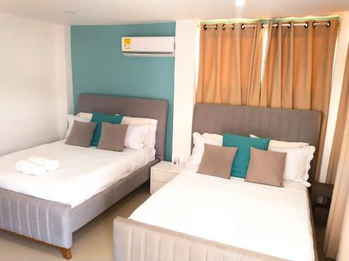 Postel nebo postele na pokoji v ubytování CC House Cartagena