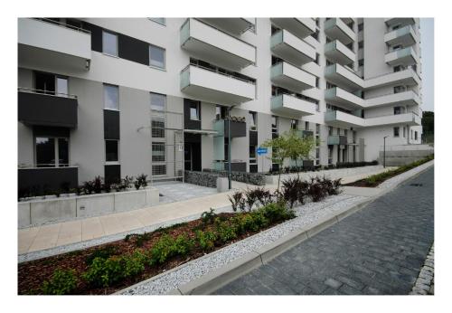 an empty street in front of a building at JTB Nautica Aparthotel in Szczecin