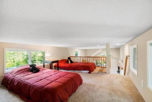 a large bedroom with two beds and a balcony at New Tiny Home Steps Away From Mt. Rainier in Ashford