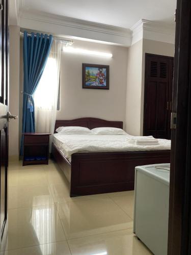 Кровать или кровати в номере Khách sạn Hoàng Minh Châu Mỹ Phước