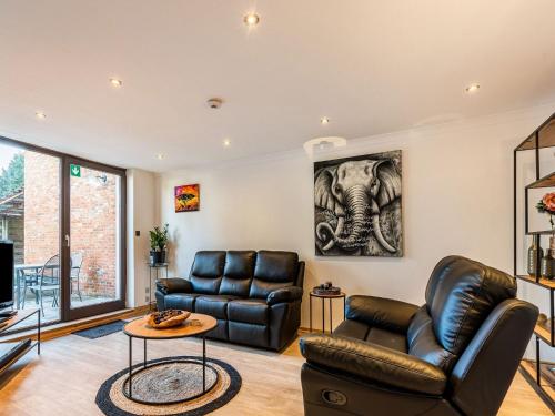 A seating area at Restful Holiday home in Herselt with Garden