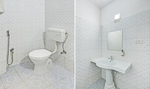 a bathroom with a toilet and a sink at Treebo Sidhartha International Baliapanda in Puri