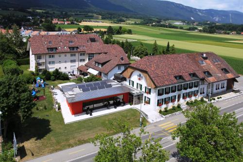 an overhead view of a building with solar panels on it at Hotel Urs und Viktor in Bettlach