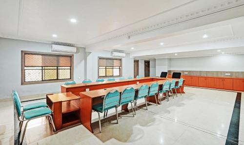 a conference room with a long table and chairs at Treebo Sidhartha International Baliapanda in Puri