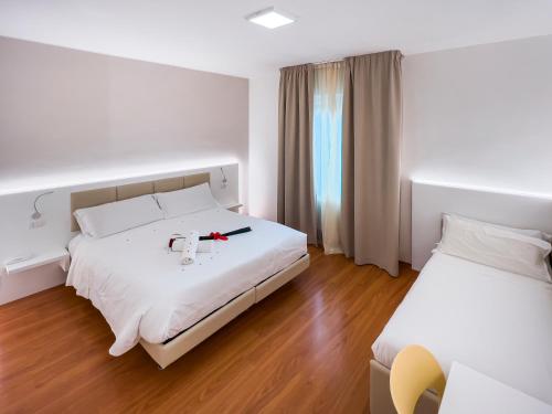 Postel nebo postele na pokoji v ubytování Hotel Gran Sasso & SPA