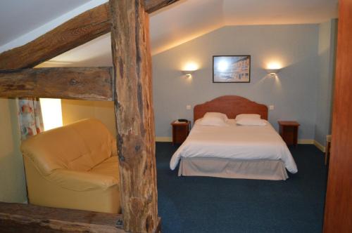 Ένα ή περισσότερα κρεβάτια σε δωμάτιο στο Auberge de Marville