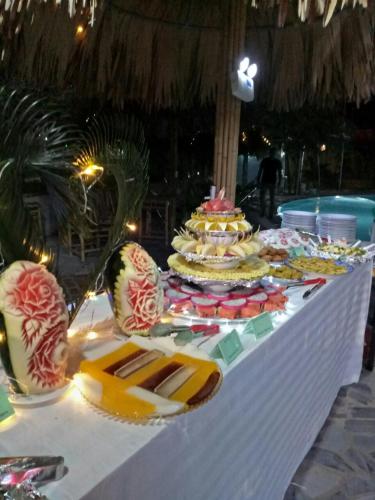 a table with many plates of food on it at Hoa lu Eco Homestay in Ninh Binh