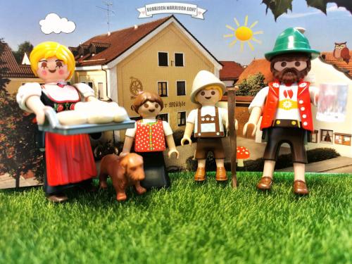 a group of toy people standing in the grass at Zur Mühle in Bad Birnbach