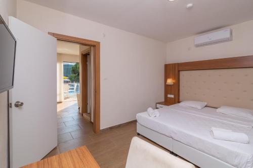 Ένα ή περισσότερα κρεβάτια σε δωμάτιο στο Ponz Hotel