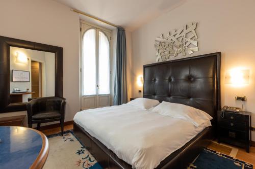Postel nebo postele na pokoji v ubytování Hotel Moderno
