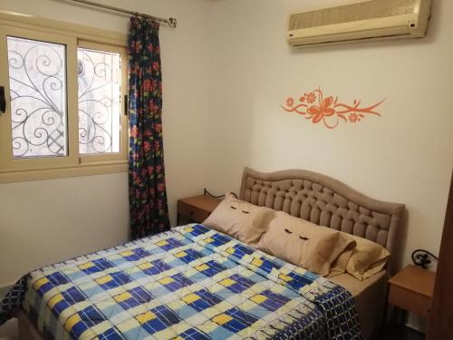 Krevet ili kreveti u jedinici u okviru objekta Stella Di Mare - Amazing Two Bedrooms Sea View Chalet - Families only