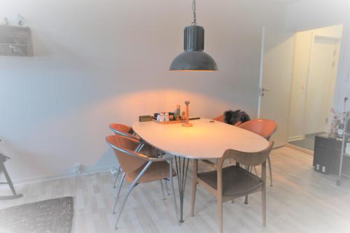 a dining room with a table and chairs at (025) Østergade 87 a. Ground Floor in Esbjerg