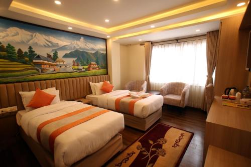 a hotel room with two beds and a window at Hotel Amarawati in Kathmandu