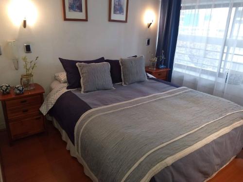 מיטה או מיטות בחדר ב-La Gloria 30. Las Condes