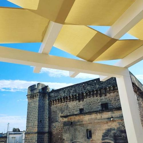 a view of a building from under a roof at Wine Suite in Torricella