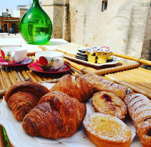 a plate of pastries and pastries on a table at Wine Suite in Torricella