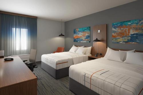 A bed or beds in a room at La Quinta Inn & Suites by Wyndham Bardstown