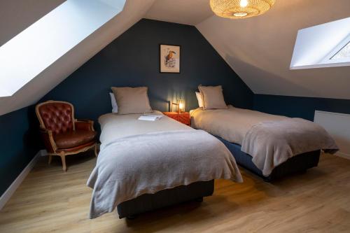 En eller flere senge i et værelse på Domaine des Pousses, Chambres d'hôtes au coeur d'un village de campagne