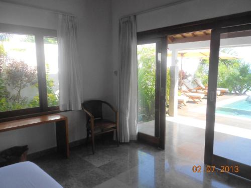 Ένα ή περισσότερα κρεβάτια σε δωμάτιο στο Amed Beach Villa