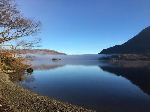 a view of a lake with fog on the water at Bayfield in Lamplugh